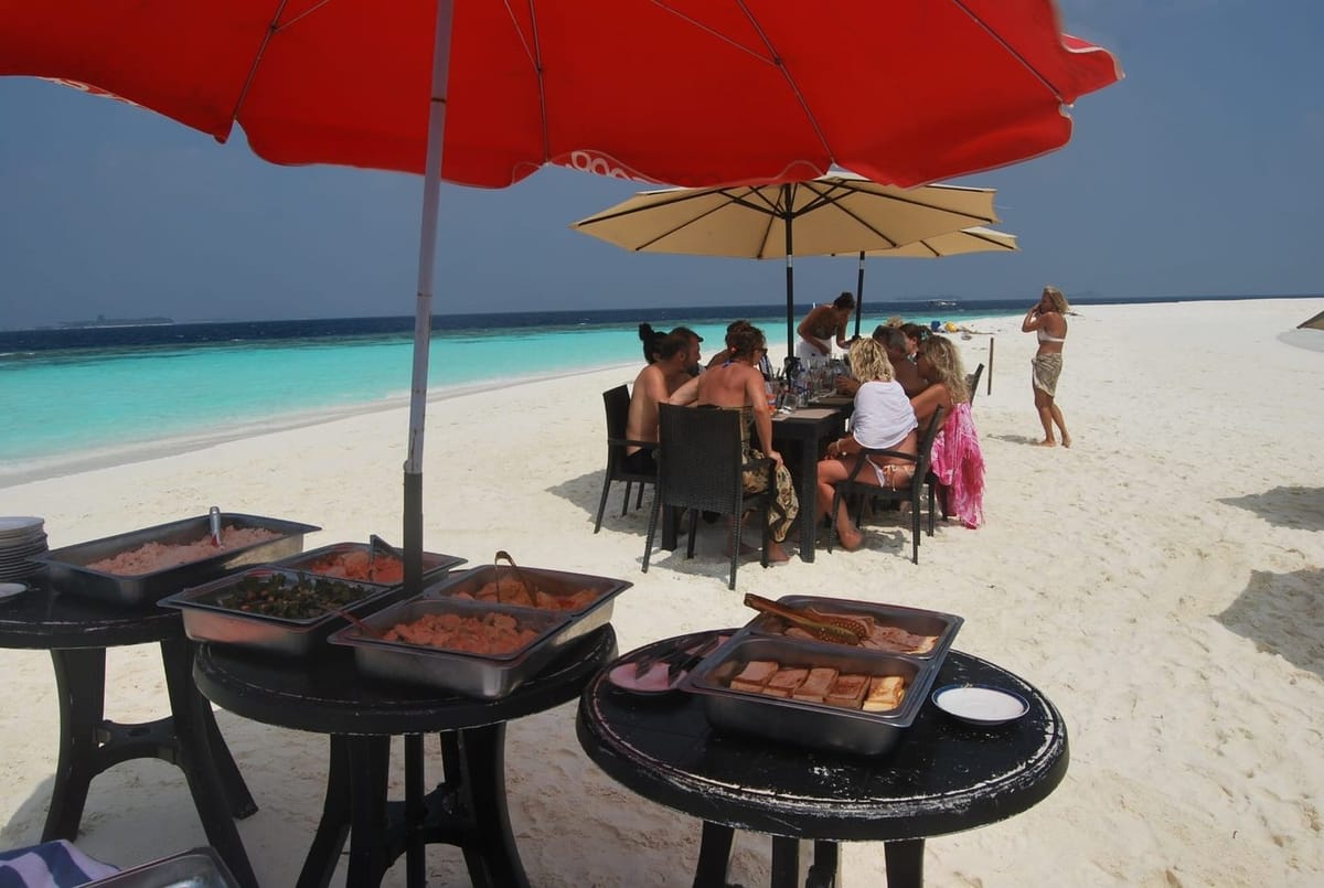 Sandbank sunset excursion with beach barbecue dining near Maamigili, South Ari Atoll